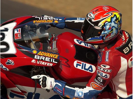 A member of the Ducati Superbike Team on the FILA-emblazoned motorbike
