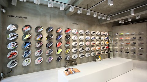 Shoes line the walls of FILA's new 3-story mega shop in Itaewon, Seoul