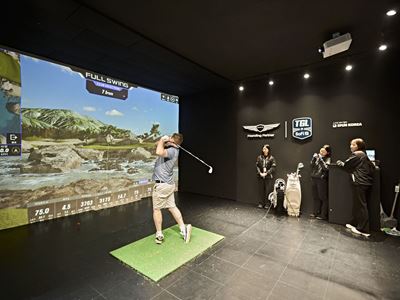 A FAN TRIES OUT THE TGL SWING SIMULATOR AT THE FAN VILLAGE OF THE 2025 GENESIS CHAMPIONSHIP IN CHEONAN KOREA