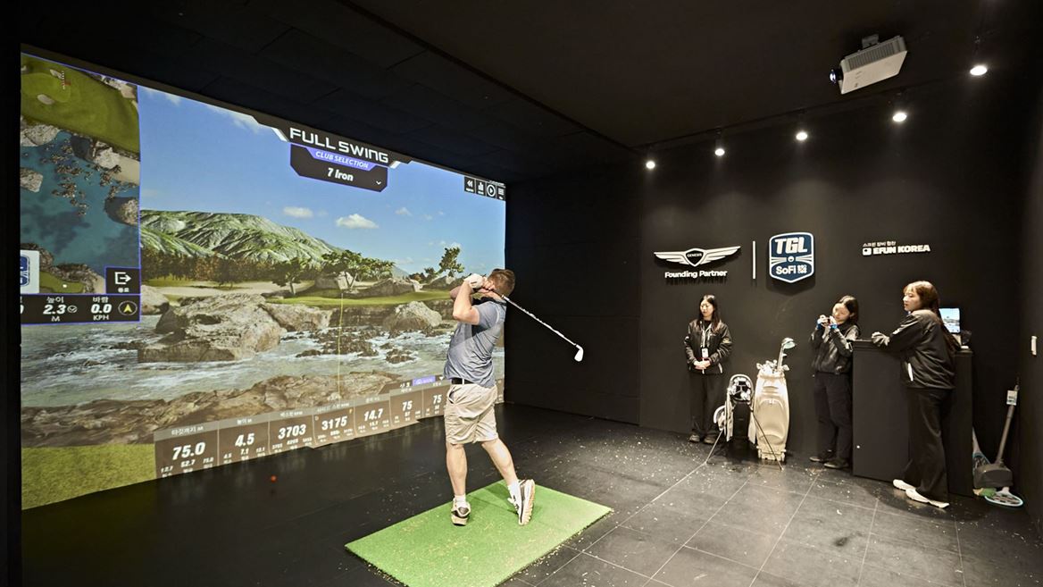 A FAN TRIES OUT THE TGL SWING SIMULATOR AT THE FAN VILLAGE OF THE 2025 GENESIS CHAMPIONSHIP IN CHEONAN KOREA