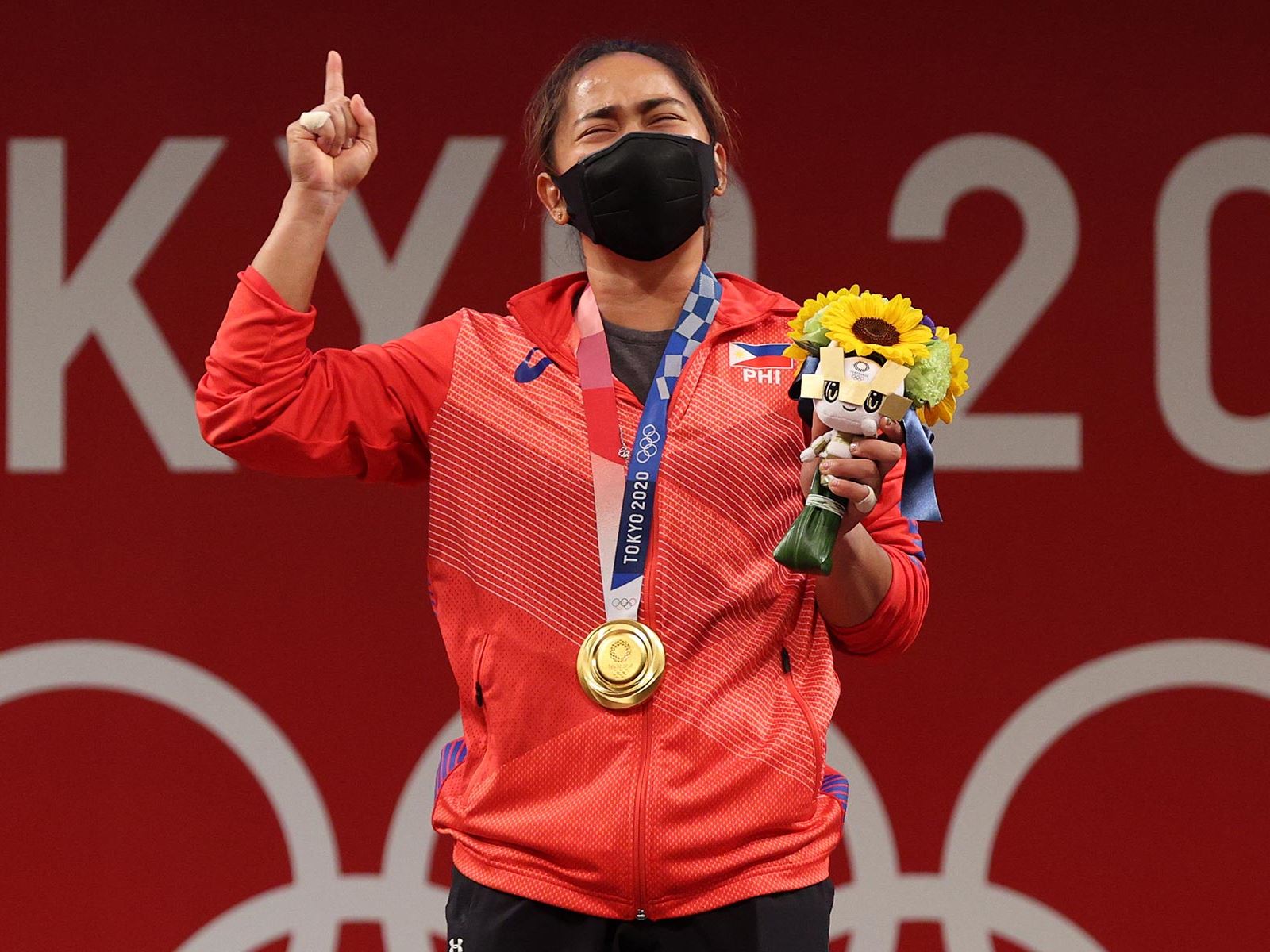 Hidilyn Diaz winning a first-ever Olympic gold medal for the Philippines in weightlifting