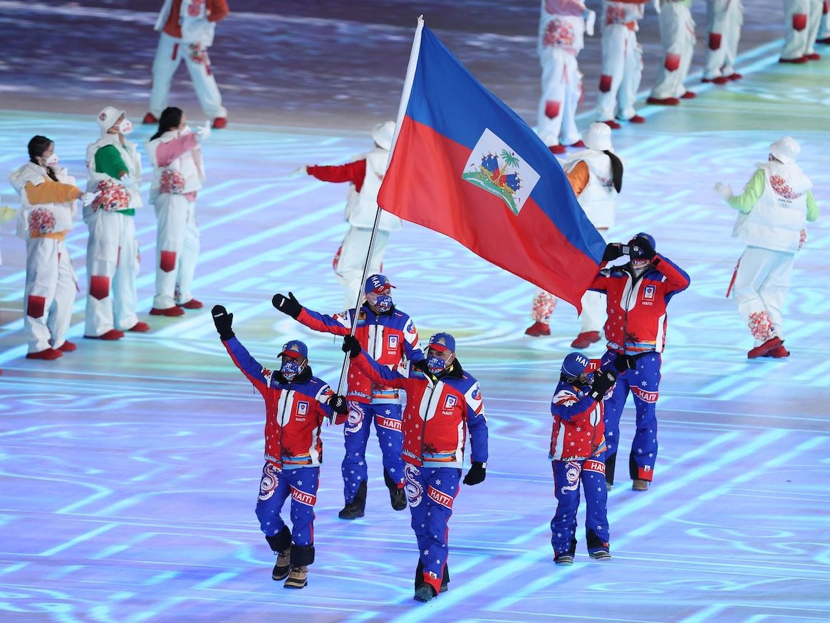 Flag bearer Richardson Viano of Team Haiti