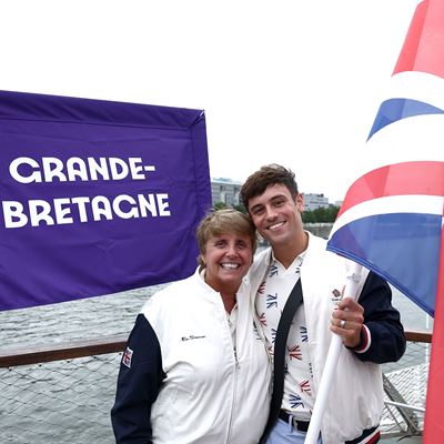 Thomas Daley Flagbearer of Team Great Britain poses for a photo with his coach Jane Figueiredo during the Opening Cere