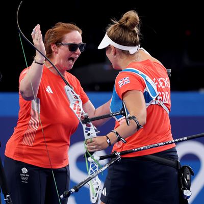 Megan Havers of Team Great Britain R celebrates with her coach Naomi Folkard L during the Archery Women s Individual