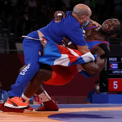 CHIBA JAPAN AUGUST 02 Mijain Lopez Nunez of Team Cuba celebrates with his coaching staff after defeating Iakobi Kaja