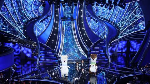 The mascots of Milano Cortina 2026 on the Teatro Ariston stage during the Sanremo Music Festival 2024.