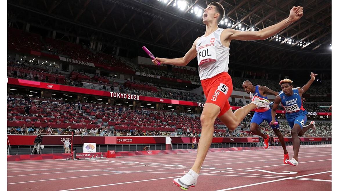 Kajetan Duszynski of Team Poland celebrates after crossing the finishing line to win gold in the 4 x 400m Mixed Relay Fi
