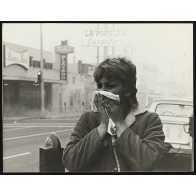Woman Covering Mouth
