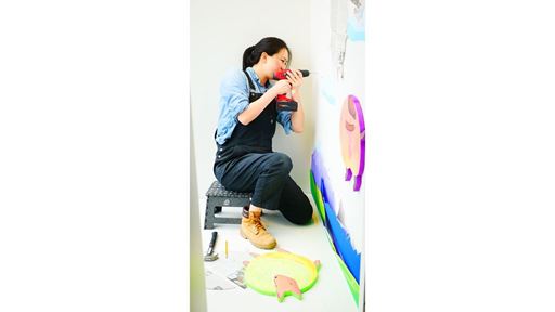 Vivian Li working on an art installation