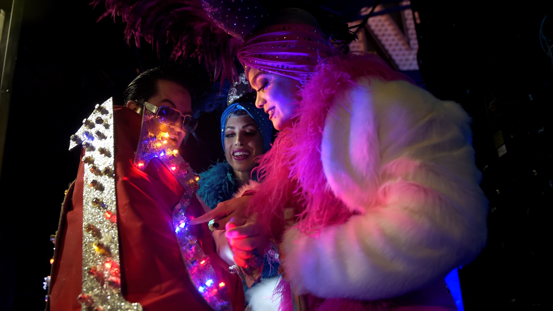 Showgirls and Elvis celebrate New Year's Eve