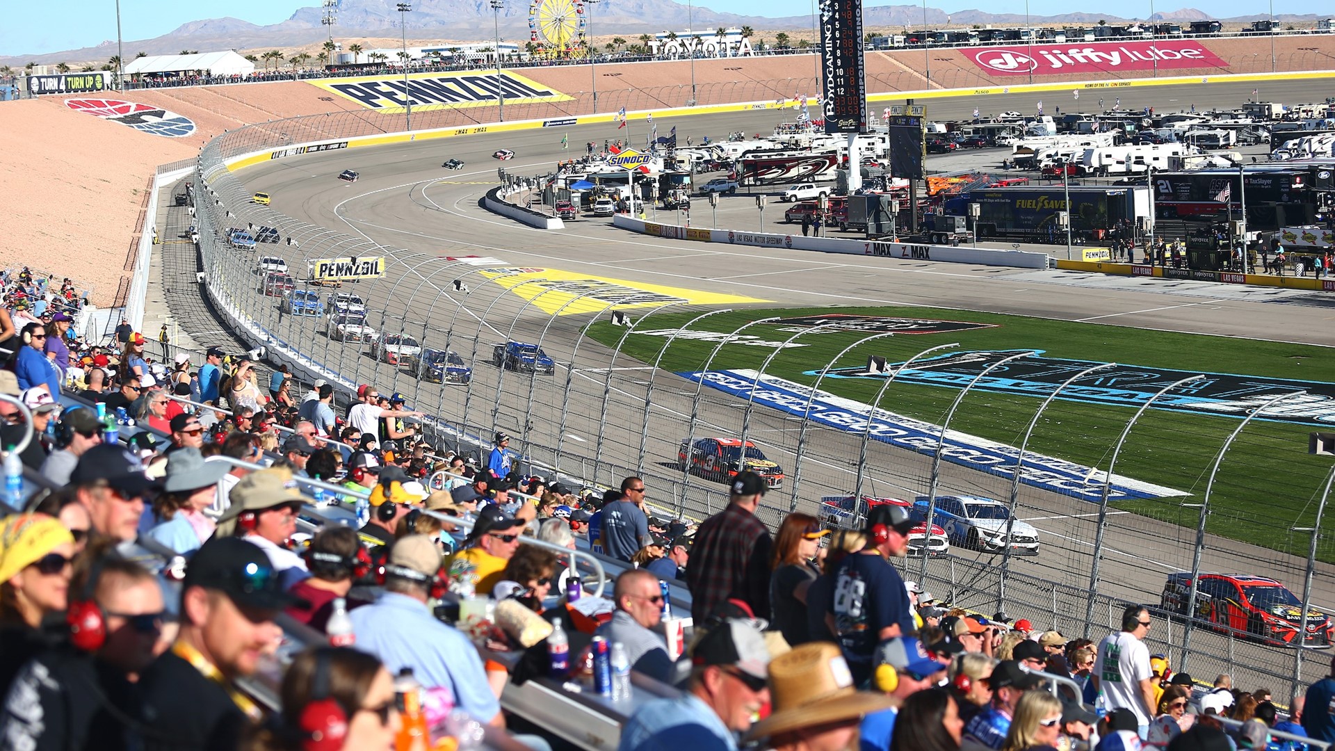 Attendees watch the NASCAR Cup Series Pennzoil 400
