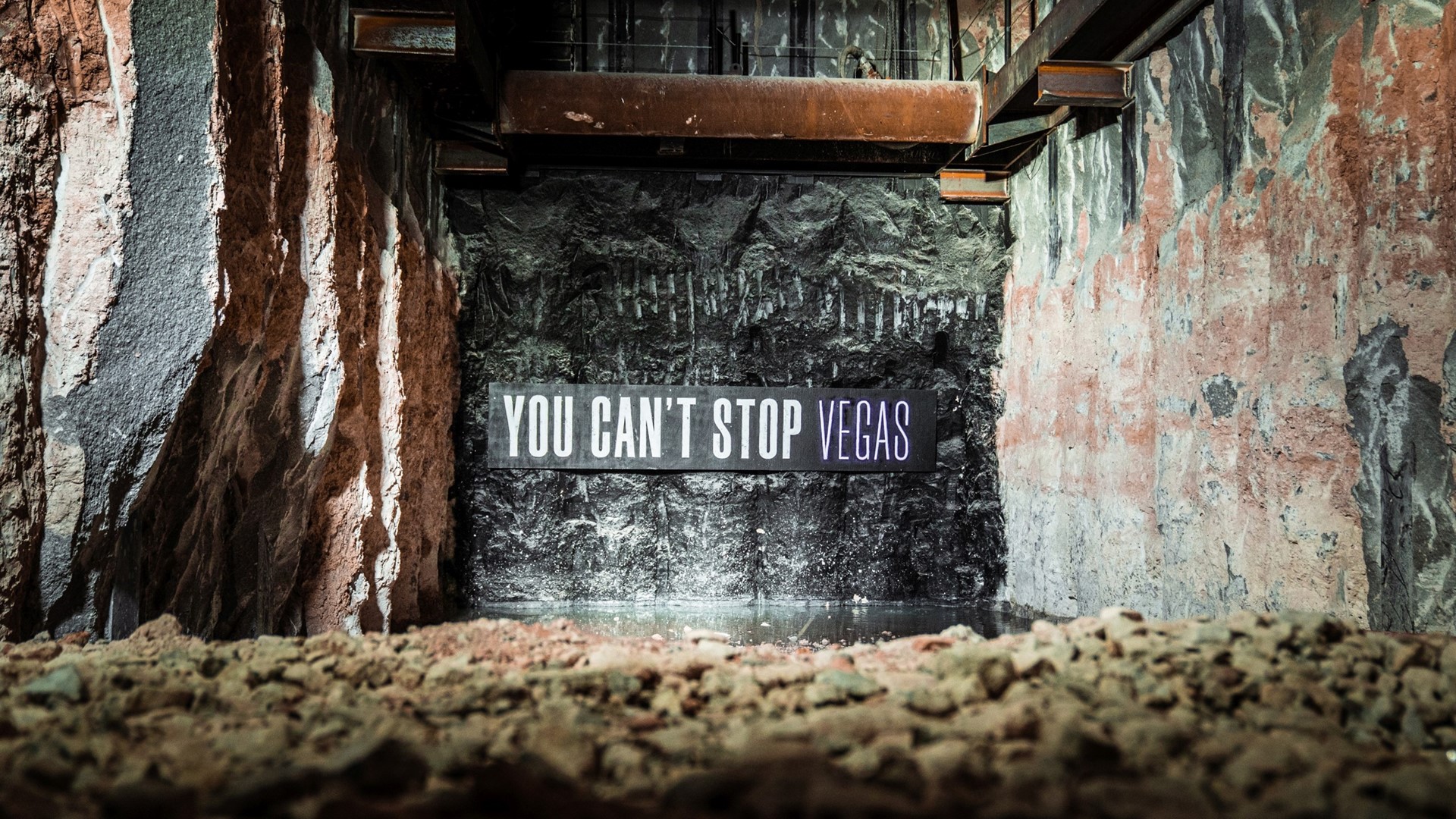 "You Can't Stop Vegas" banner before Elon Musk's boring machine breaks through tunnel wall