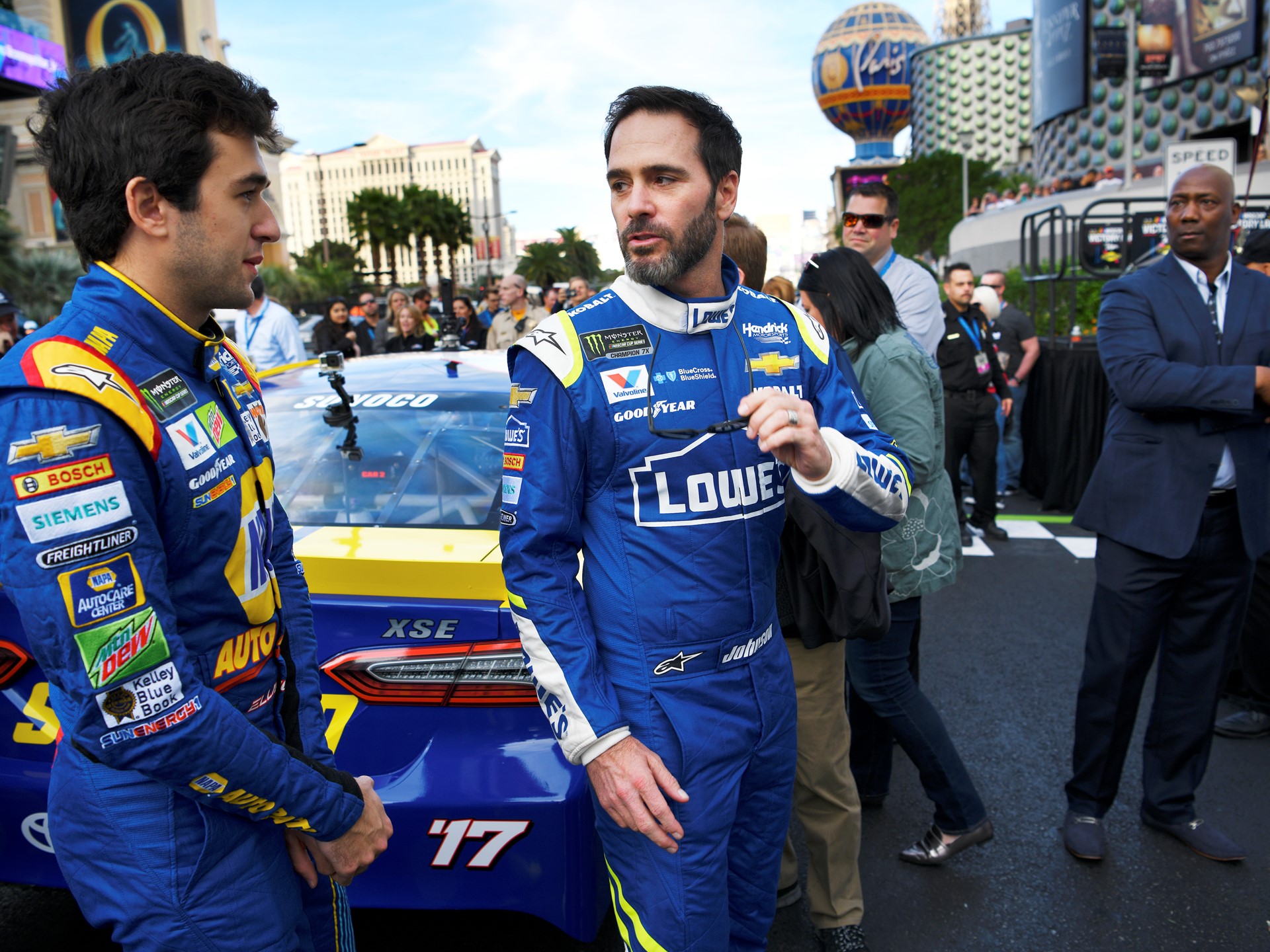 NASCAR Cup Series driver Jimmie Johnson, right, talks with Chase Elliott