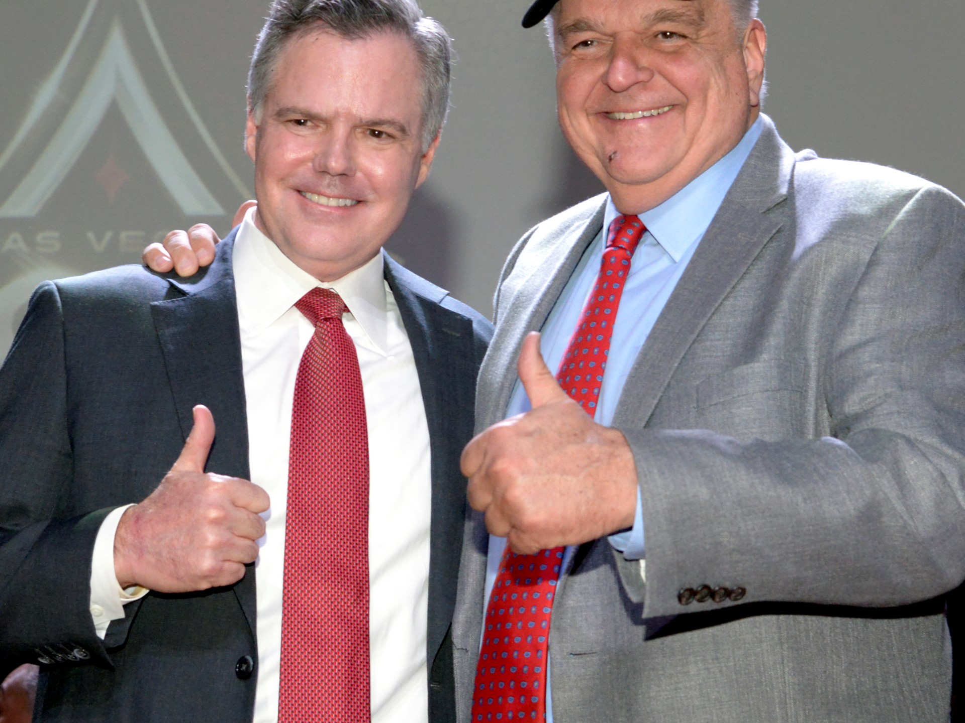 Jim Murren (l) Chairman and CEO of MGM Resorts International and Clark County Commissioner Steve Sisolak, wearing the ne