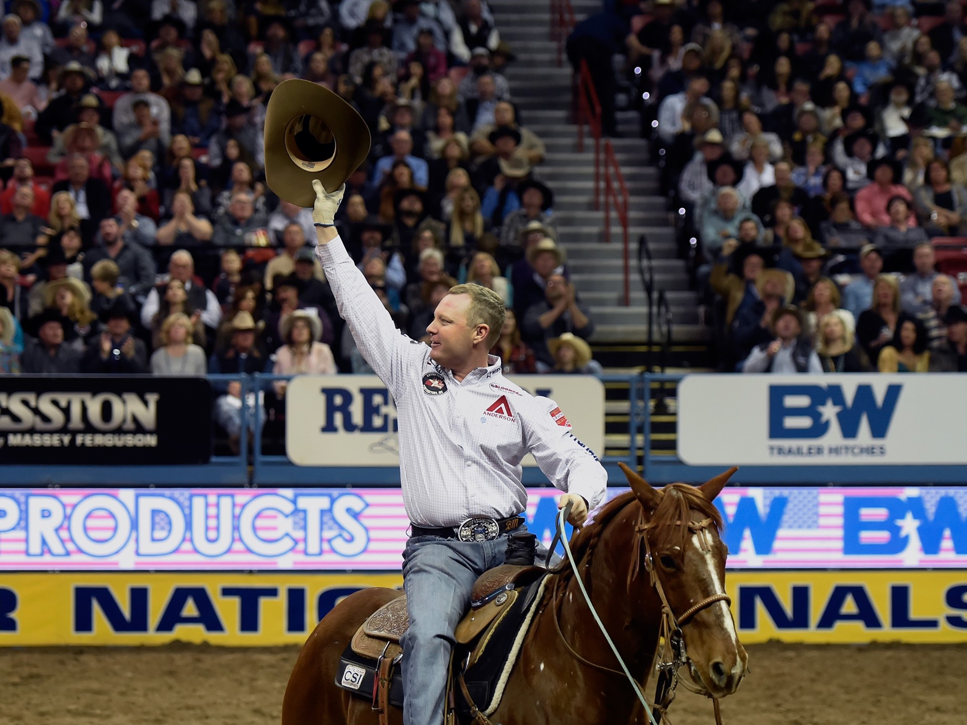 Brady Minor acknowledges the crowd after competing in the team roaring during the seventh go-round of the National Final