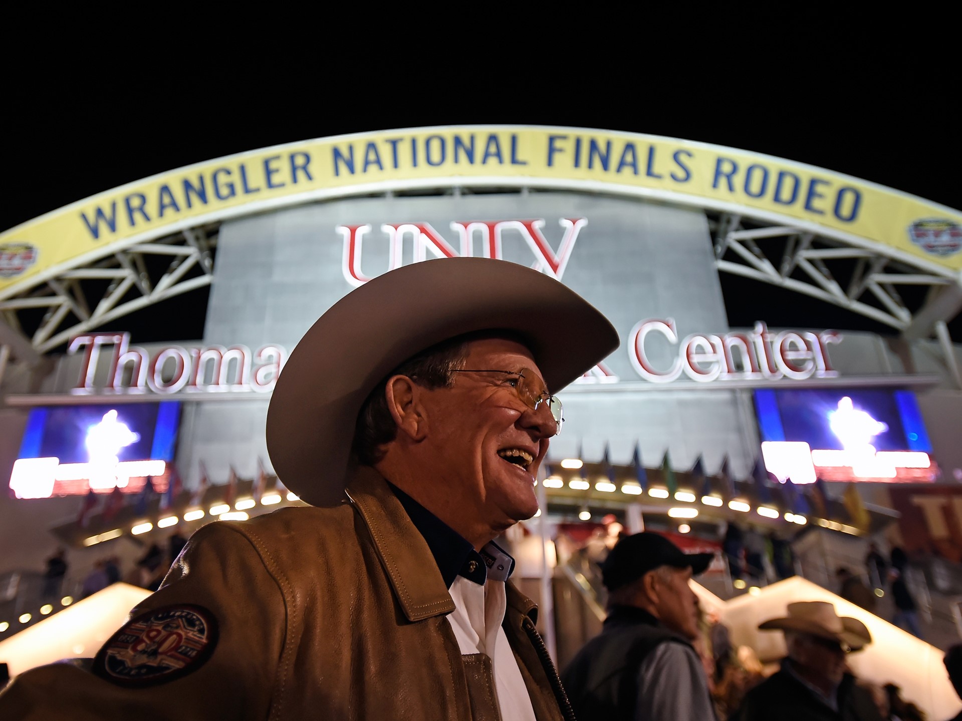 Delbert Warren of Oklahoma is all smiles before as he arrives for the seventh go-round of the National Finals Rodeo