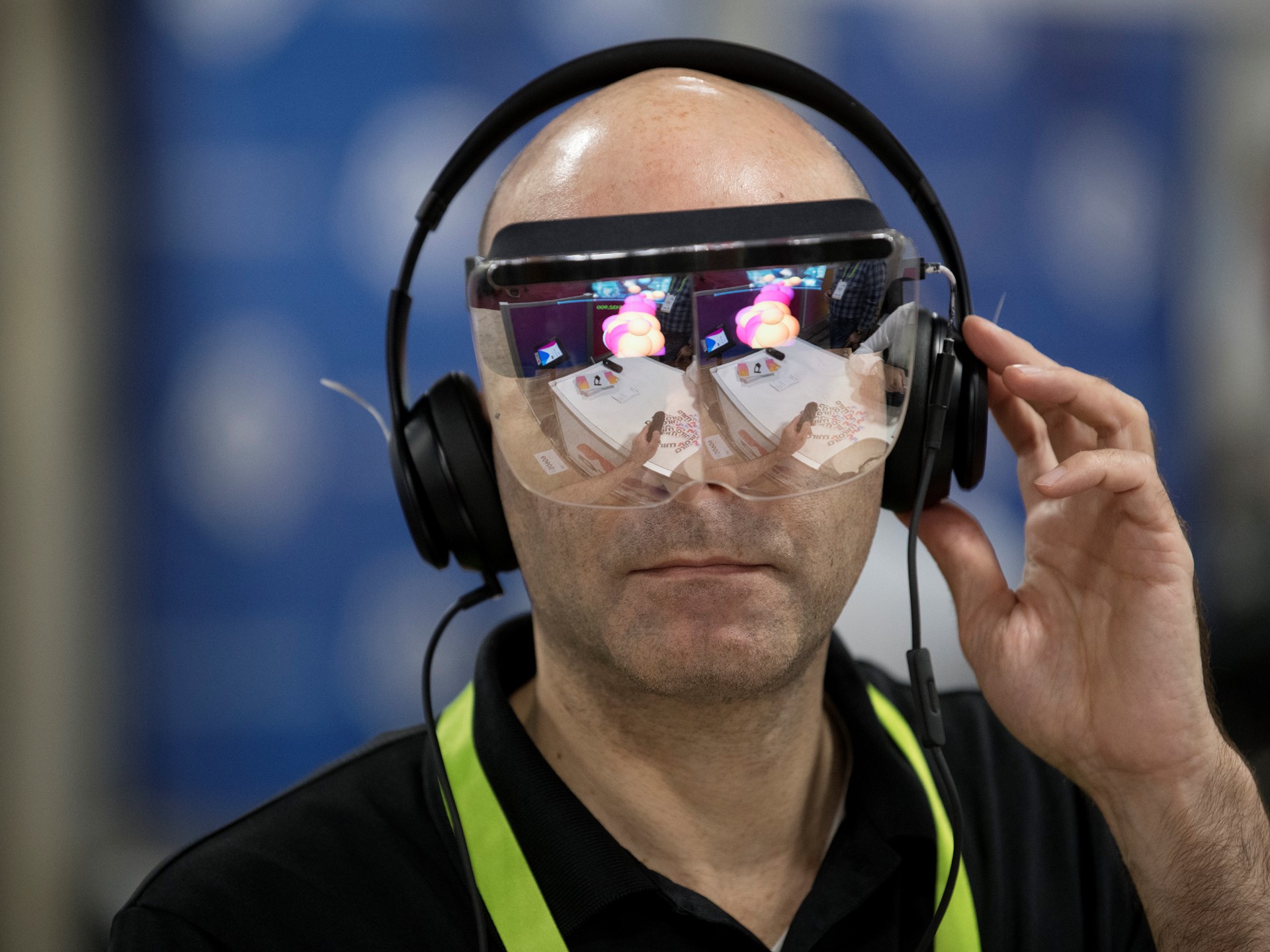 Yaron Asher tries out a virtual reality headset from start-up Mira Reality