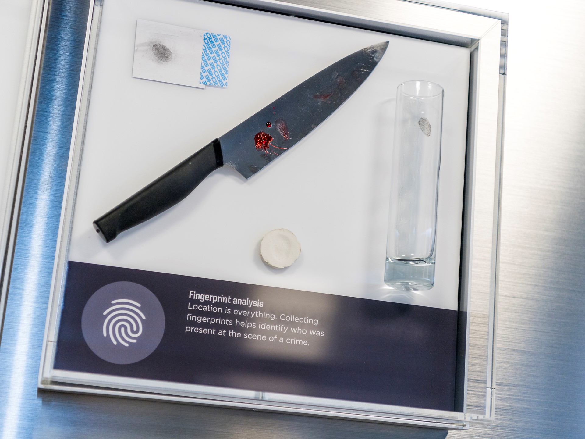 An exhibit introduces guests to fingerprint evidence in the Crime Lab at the Mob Museum