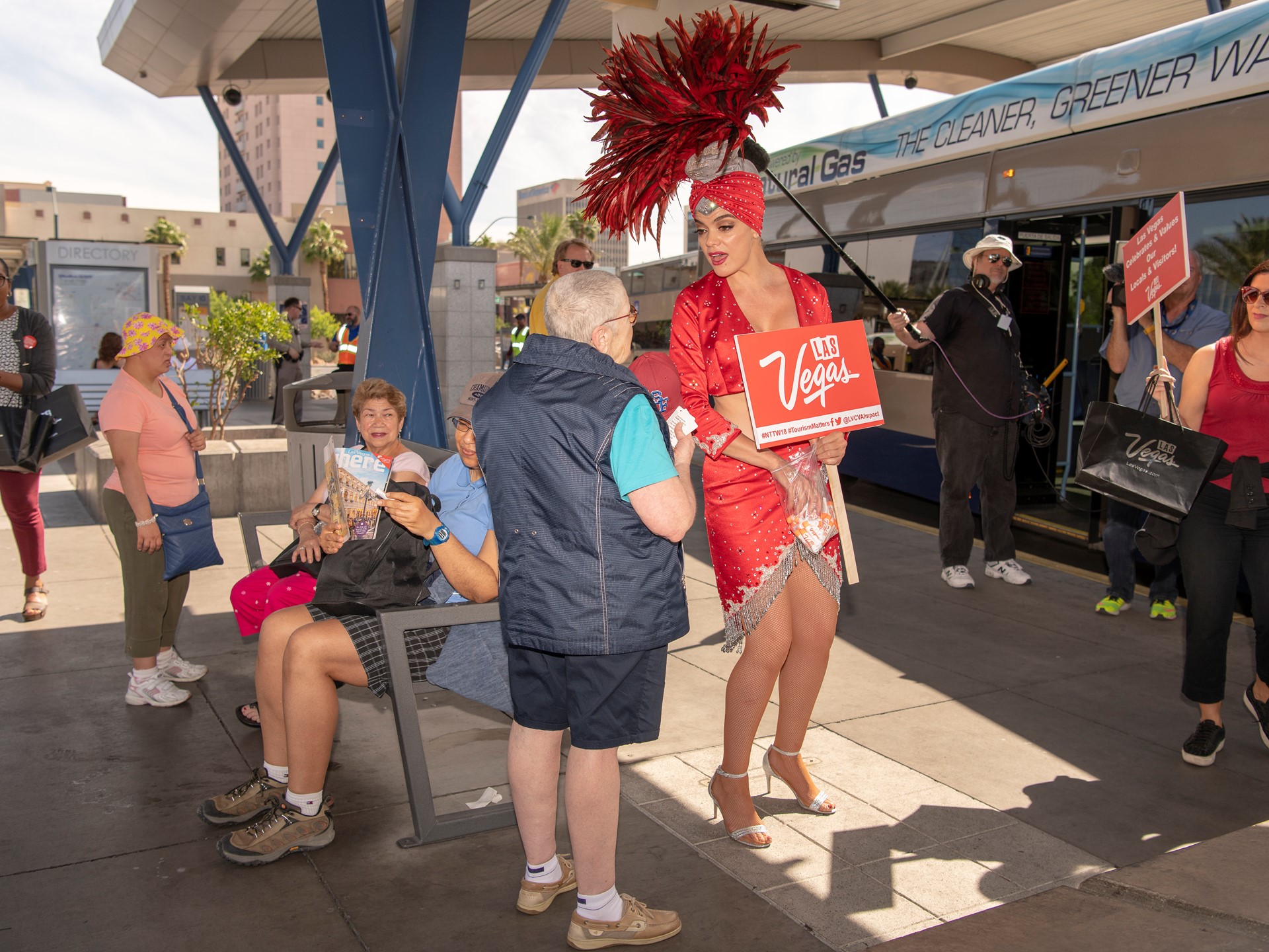 Las Vegas showgirl Porsha Revesz greets riders at the Bonneville RTC Transit Stations