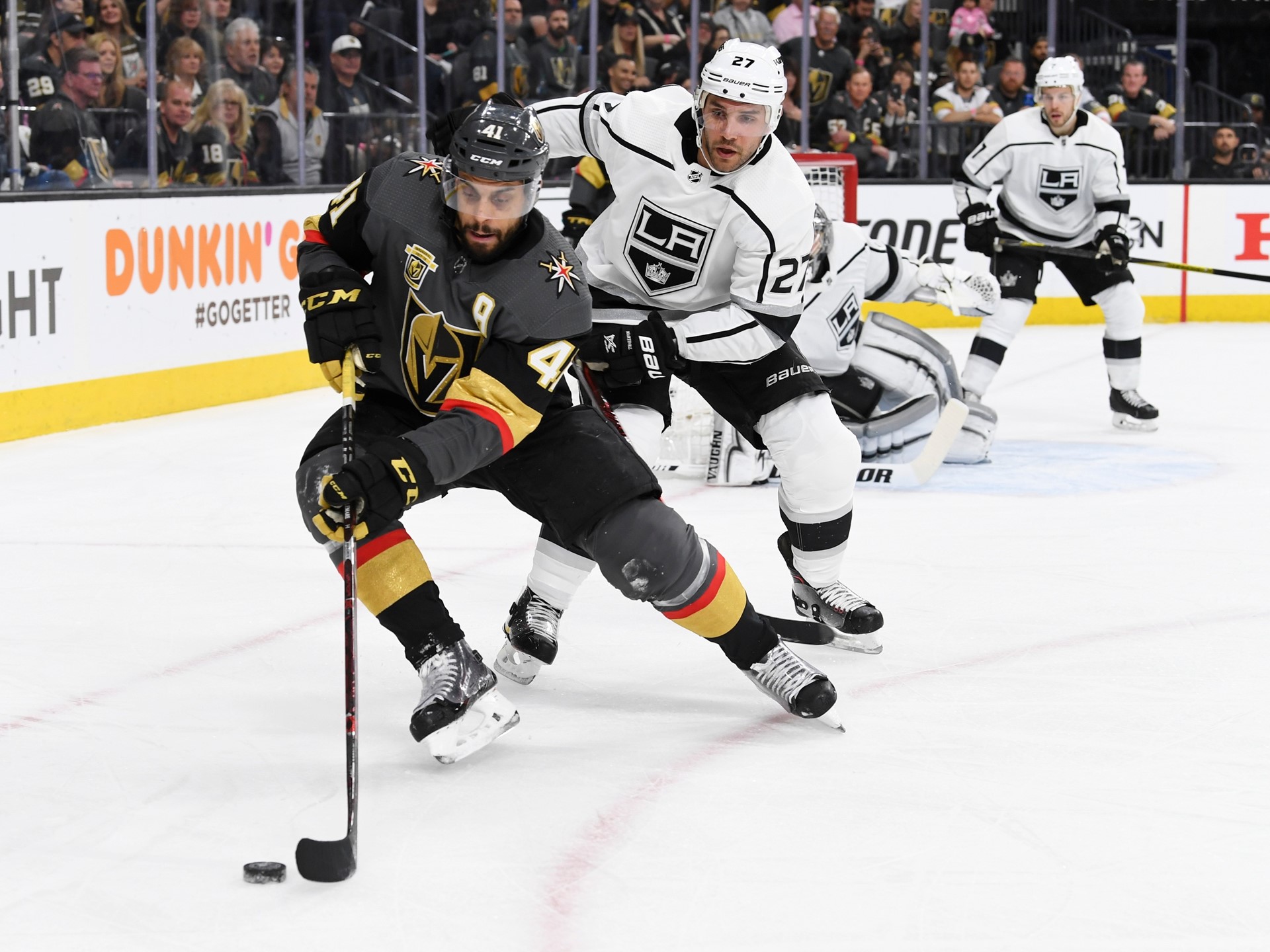 Vegas Golden Knights left wing Pierre-Edouard Bellemare is defended by Los Angeles Kings defenseman