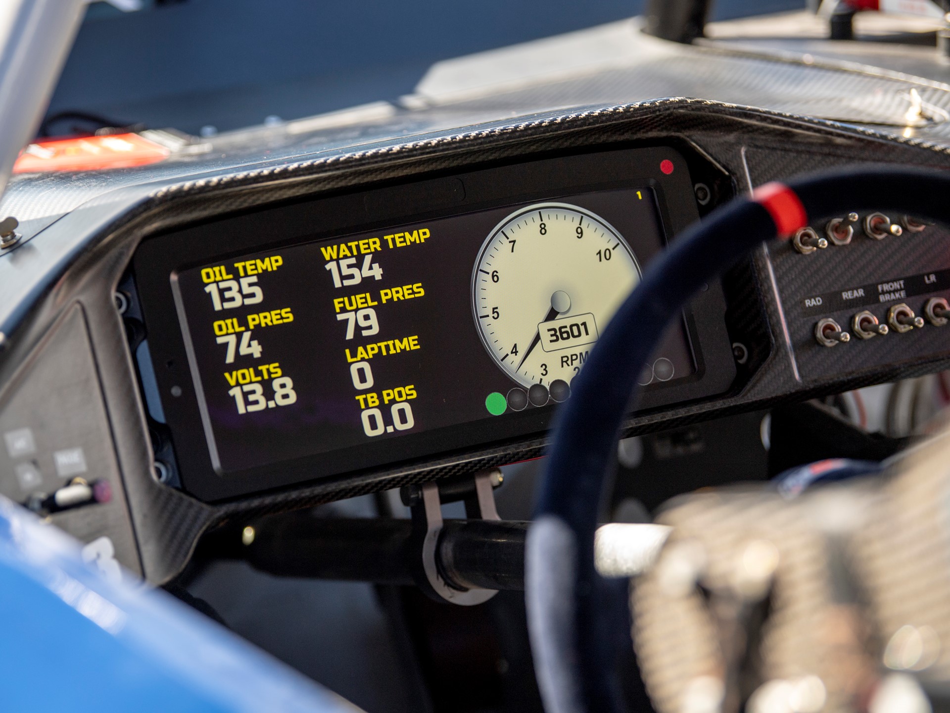 The digital dashboard of a car is lit up during tuning in preparation ...