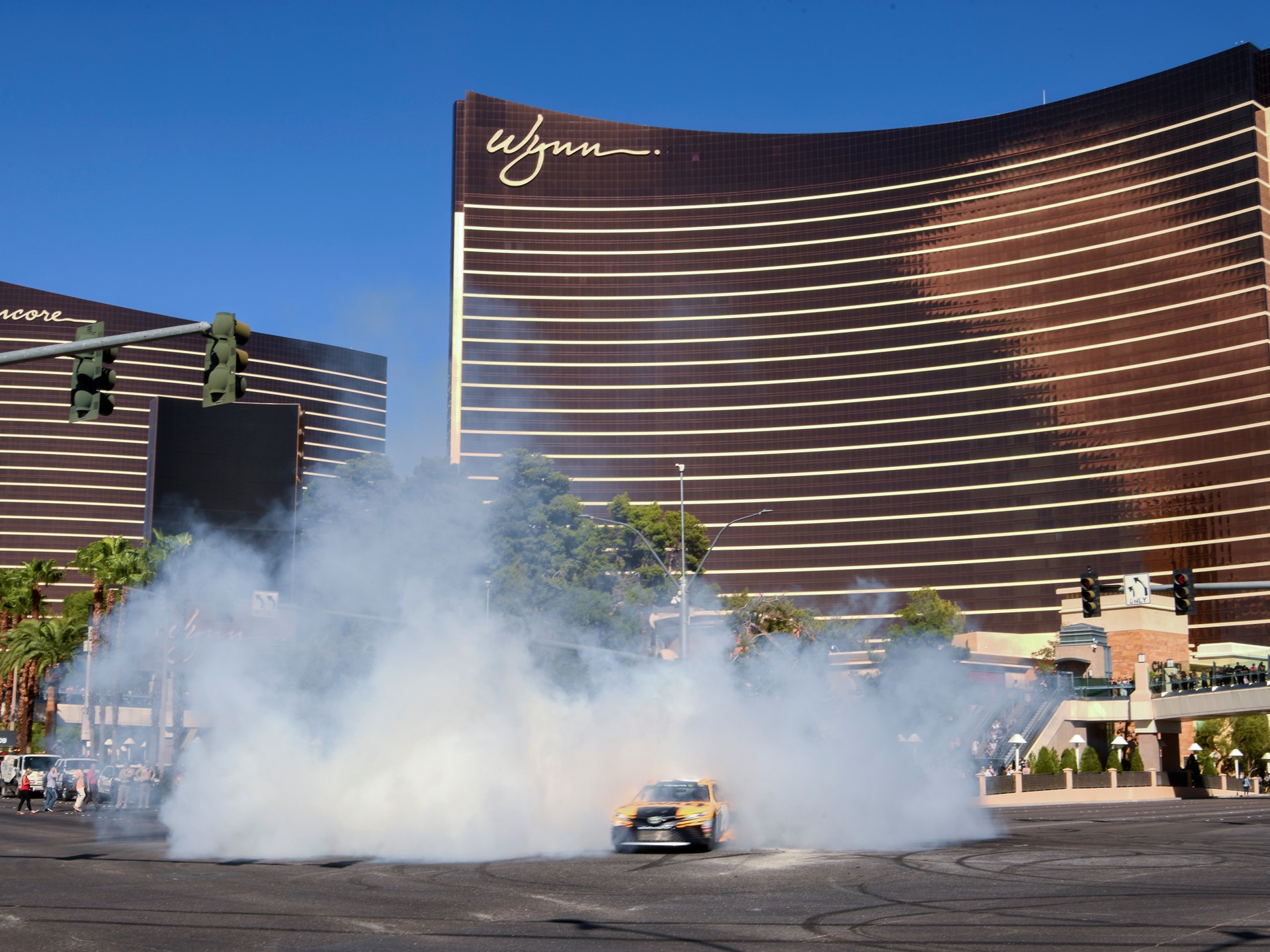 Erik Jones emerges from a cloud of smoke during the 2018 NASCAR Burnout Blvd