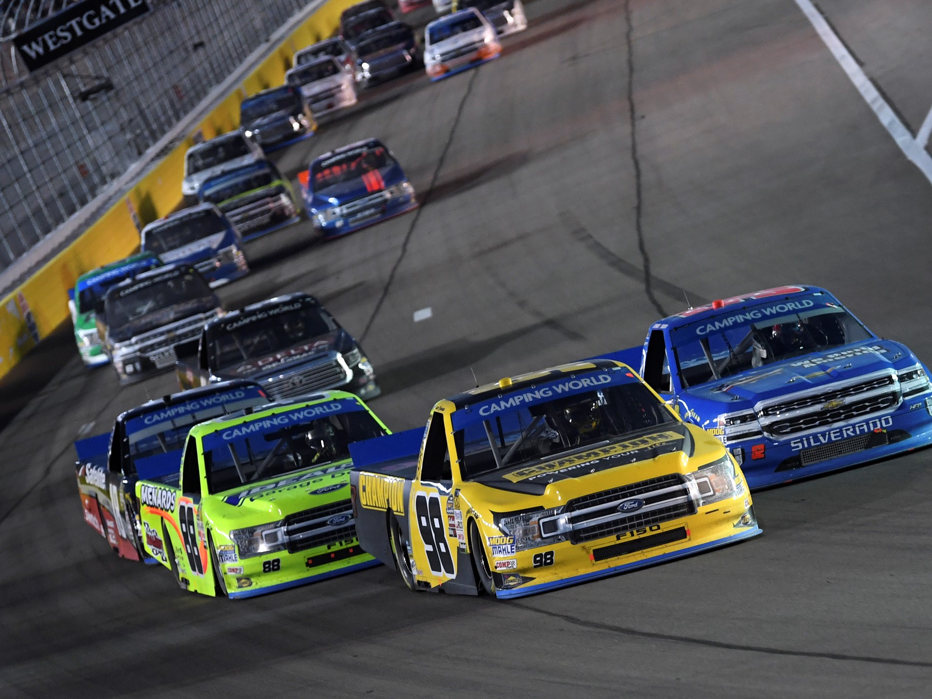 Eventual winner Grant Enfinger (98) leads the field on a restart during the NASCAR Camping World Truck Series World of W