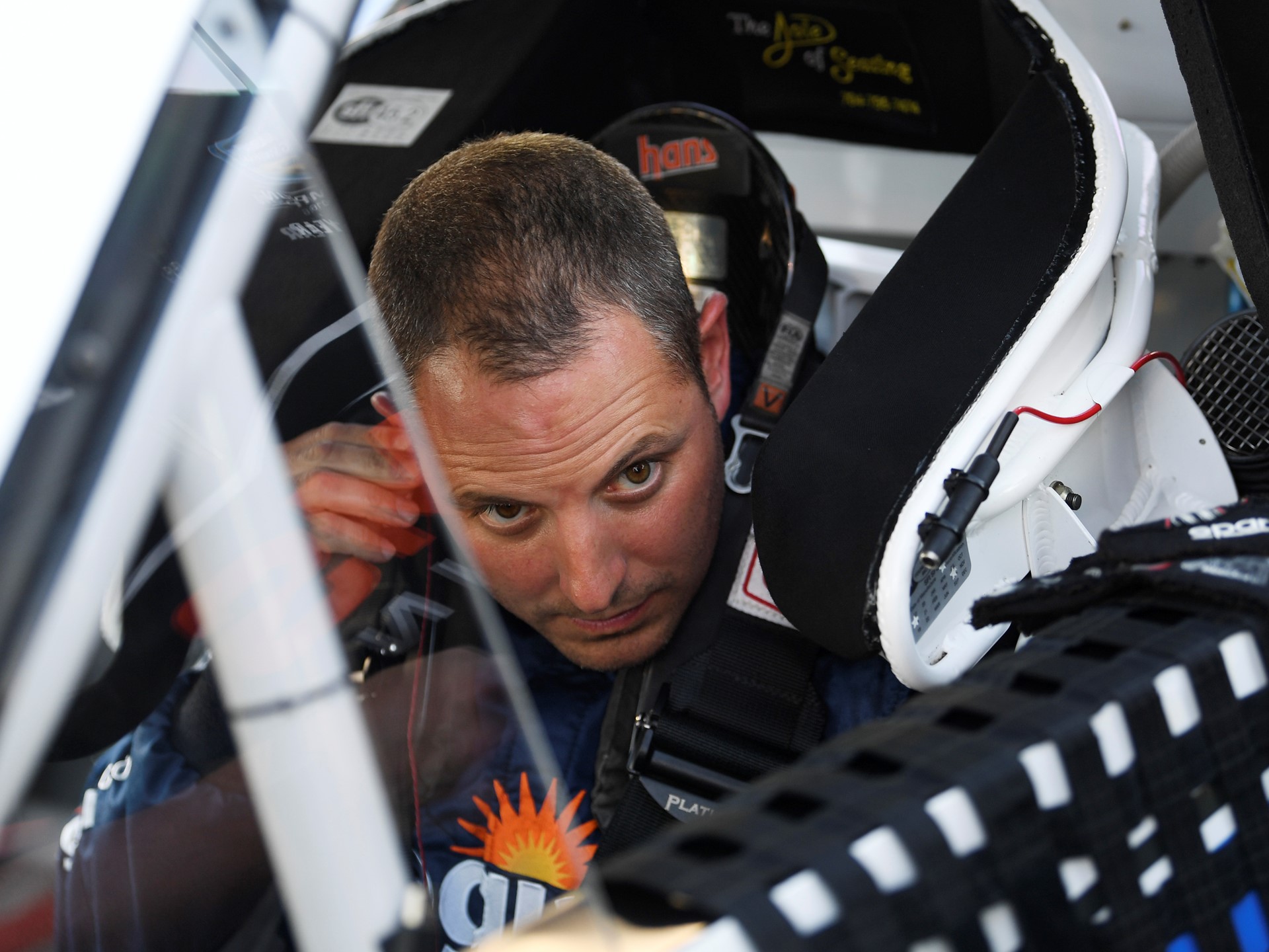 Johnny Sauter (21) Allegiant Chevrolet Silverado puts in his ear piece