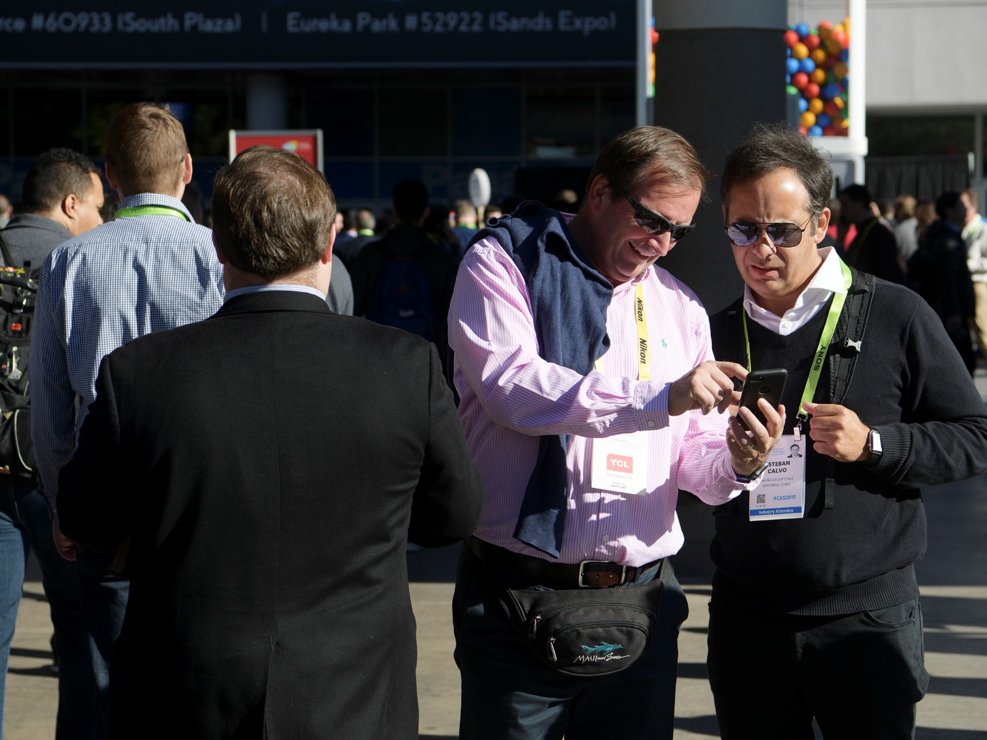 Attendees check their phone