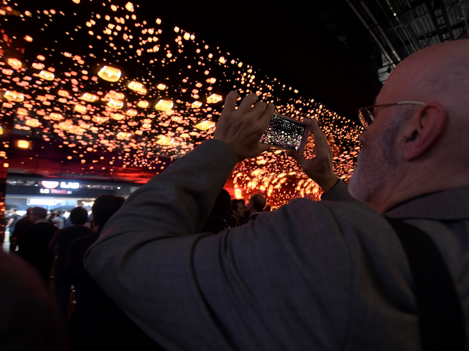 Attendees take photos