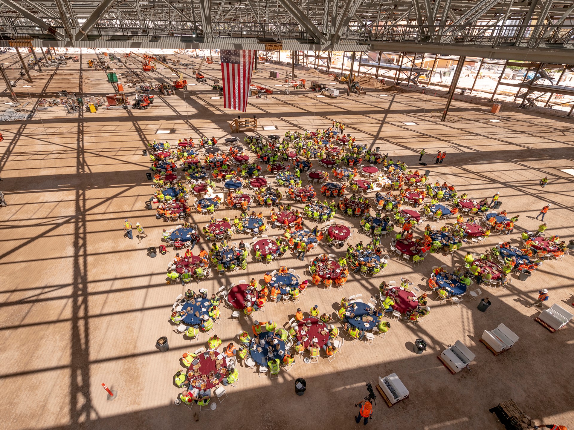 Workers gather inside the new exhibit hall as Turner/Martin-Harris recognizes its tradespeople