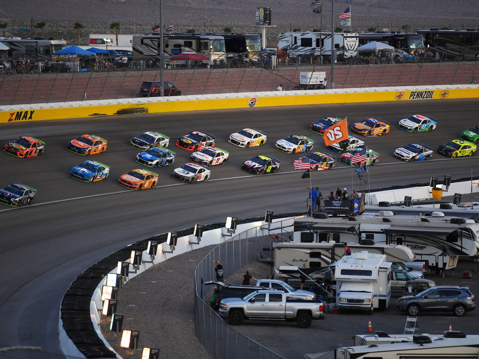 The field heads through turn three