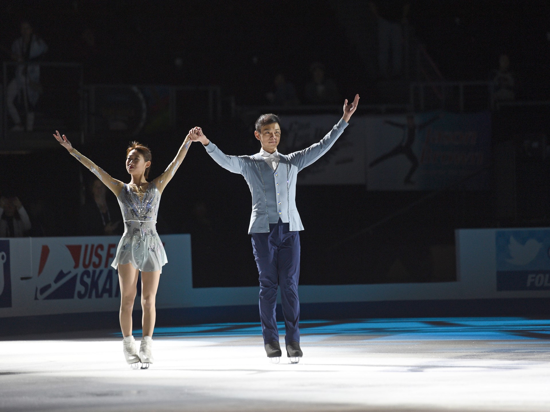 Gold medalist Peng Cheng and Jin Yang of China skate together after winning the pairs competition