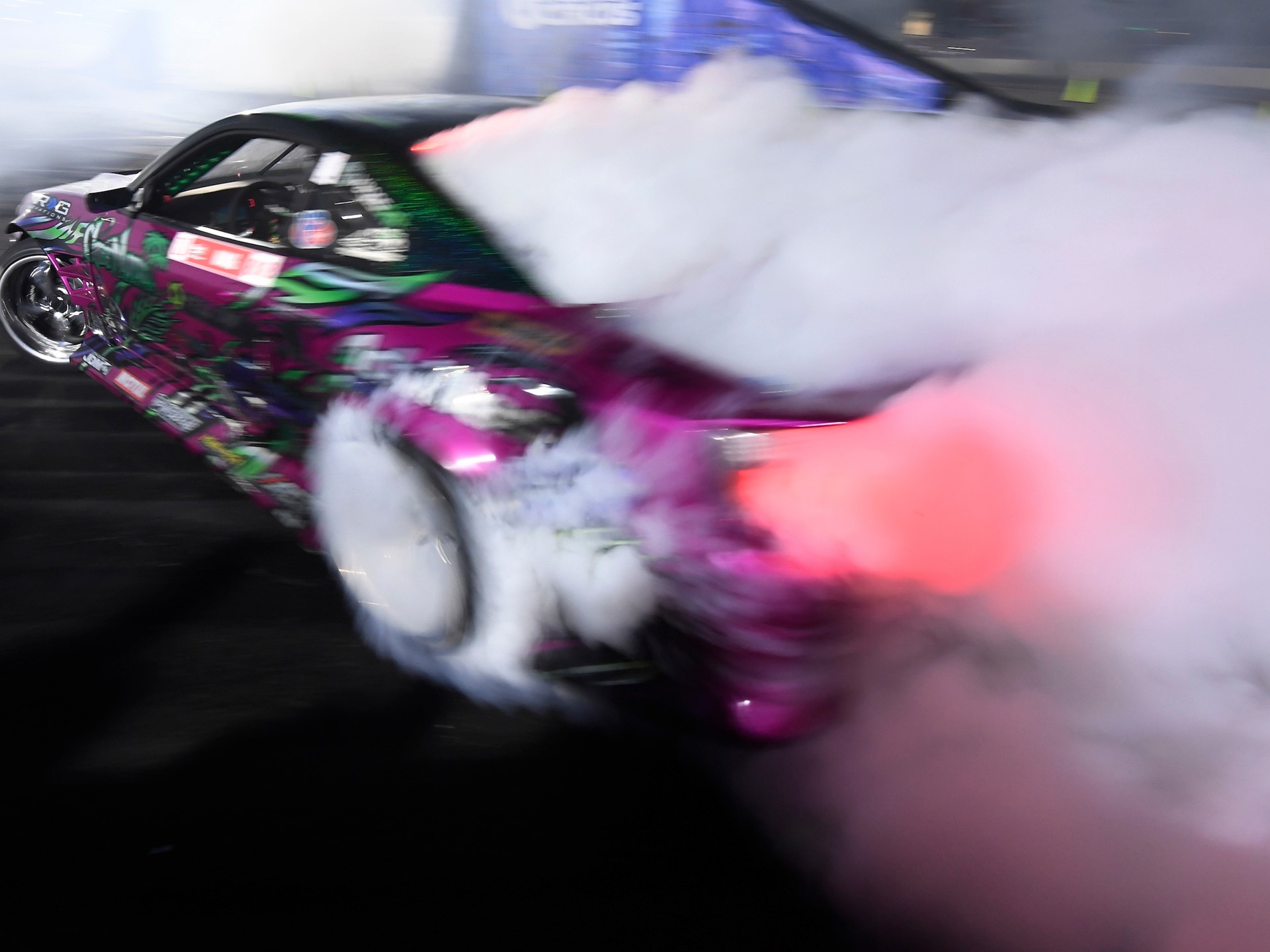 A car billows smoke
