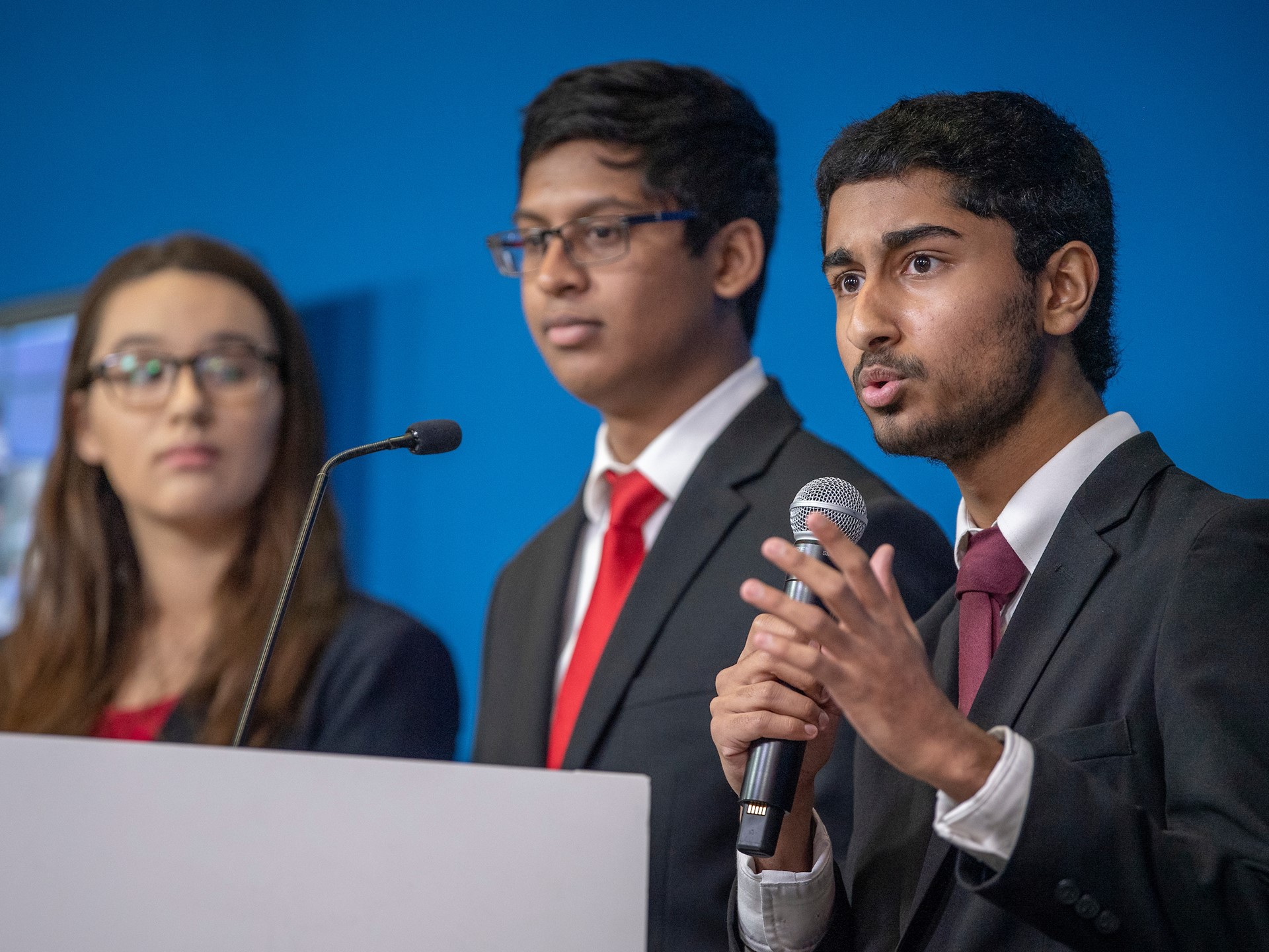Anish Chejerla, right, with teammates Elizabeth Wigington and Ishaan Raja