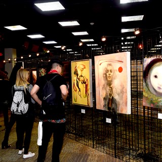 Attendees enjoying the art exhibited
