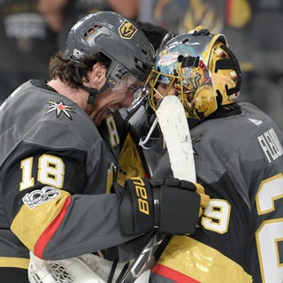Vegas Golden Knights right wing James Neal (18) congratulates Vegas Golden Knights goalie Marc-Andre Fleury (29)