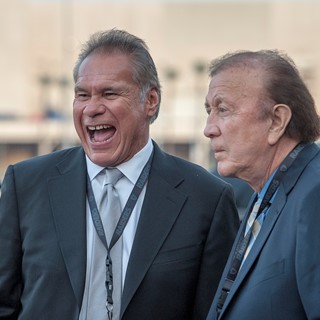 Former Oakland Raiders great Jim Plunkett, left, and coach Art Flores
