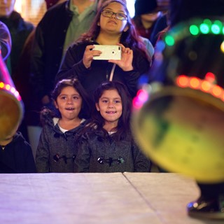 Kids watch performances onstage at the LINQ's annual tree lighting ceremony