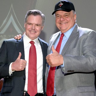 Jim Murren (l) Chairman and CEO of MGM Resorts International and Clark County Commissioner Steve Sisolak, wearing the ne