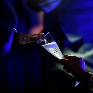 Champagne is poured just before midnight as revelers ring in the new year on top of the Rio