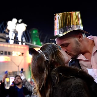 Breanna Vereeke and Graham Gugino of Michigan kiss as they bring in the new year
