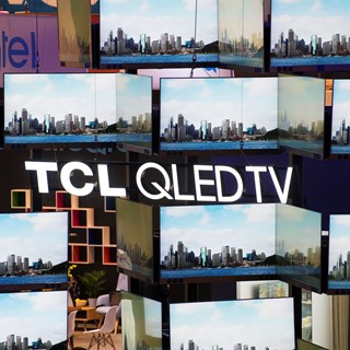 A wall of televisions from TCL is seen during the second day of CES