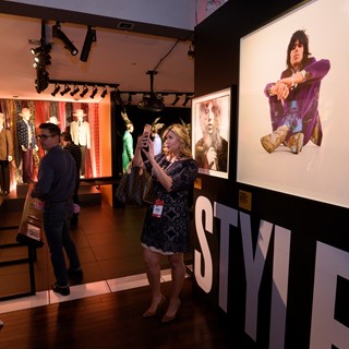 Guests browse a collection of stage outfits at the Rolling Stones "Exhibitionism"