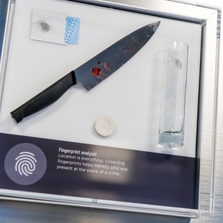 An exhibit introduces guests to fingerprint evidence in the Crime Lab at the Mob Museum