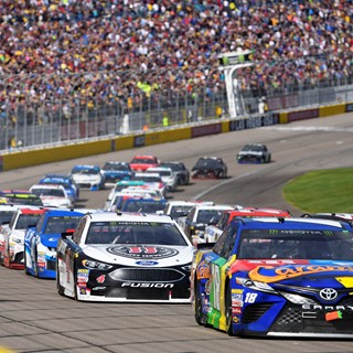 The field heads into turn one on a restart during the Monster Energy NASCAR Cup Series Pennzoil 400