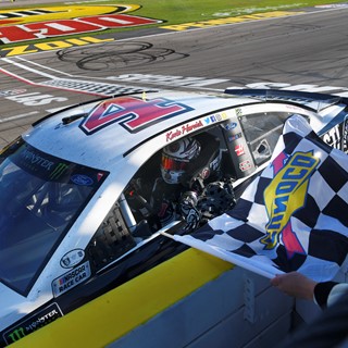 Winner Monster Energy NASCAR Cup Series driver Kevin Harvick (4) takes the checkered flag