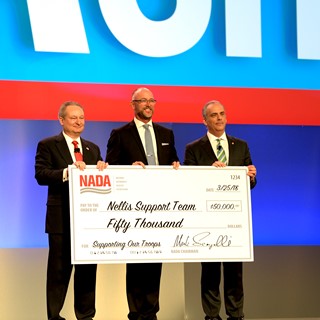 The National Automobile Dealers Association (NADA) donates $50,000 to the Nellis Support Team