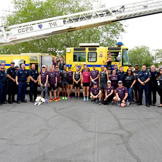 Vegas Strong Resiliency Center’s Boston Marathon Team pose with Metro Police and Clark County Fire Dept.
