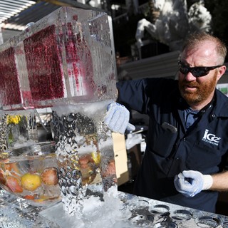 An ice sculpture gets finishing touches during the Grand Tasting